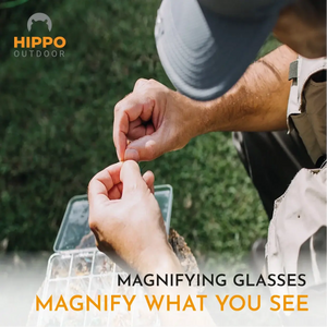 Angler tying a fly close-up using the 8270 quick-release fly fishing magnifier