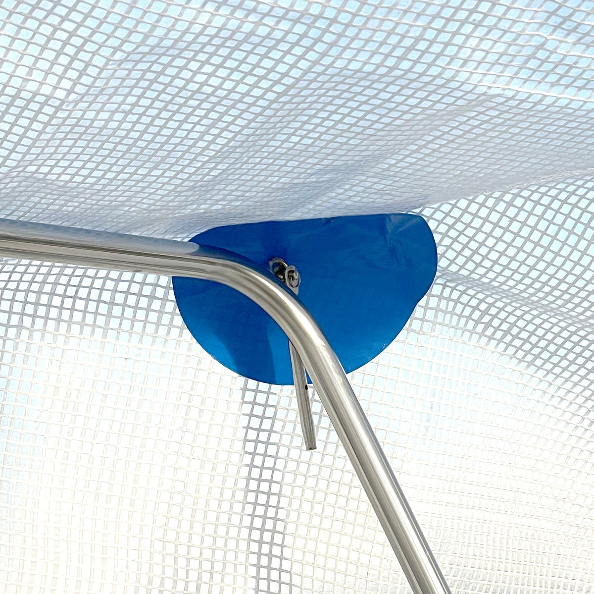 Chafe protection patch protecting a boat tarp from rubbing against a support frame
