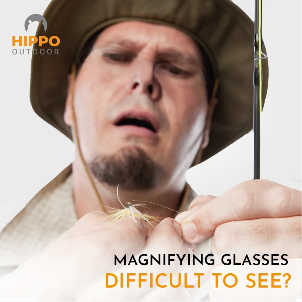 Compact fly fishing glasses with carabiner, ideal for precise adjustments.