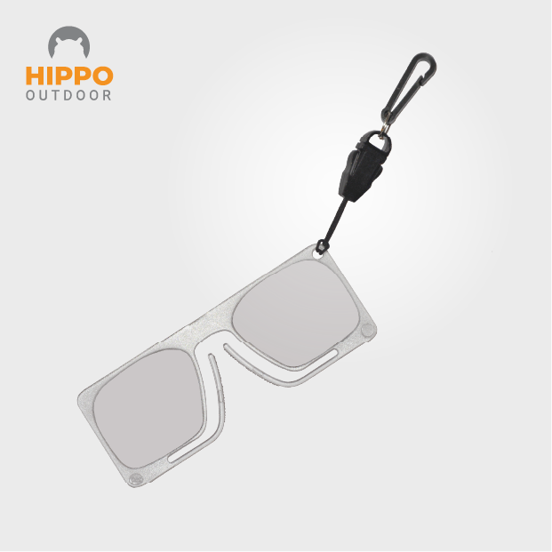 Durable fly fishing magnifier with secure carabiner attachment.