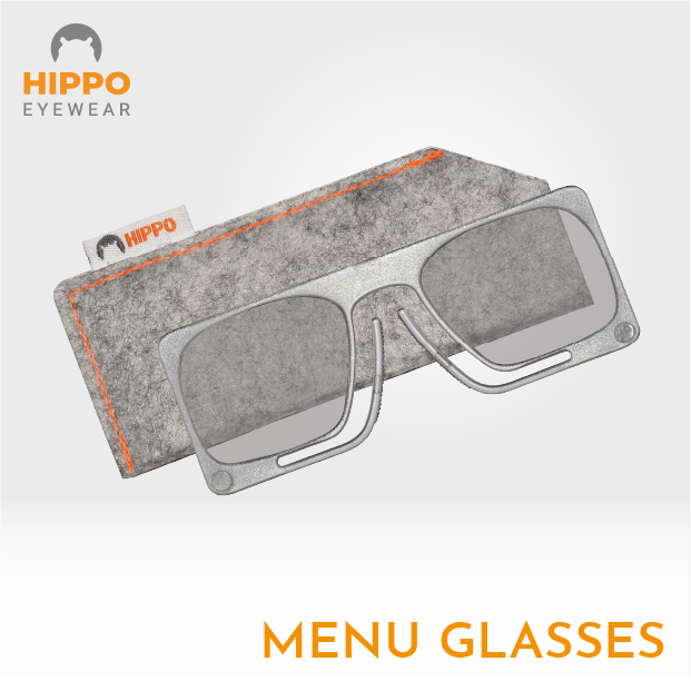 Elegant reading glasses on a restaurant table for menu navigation.