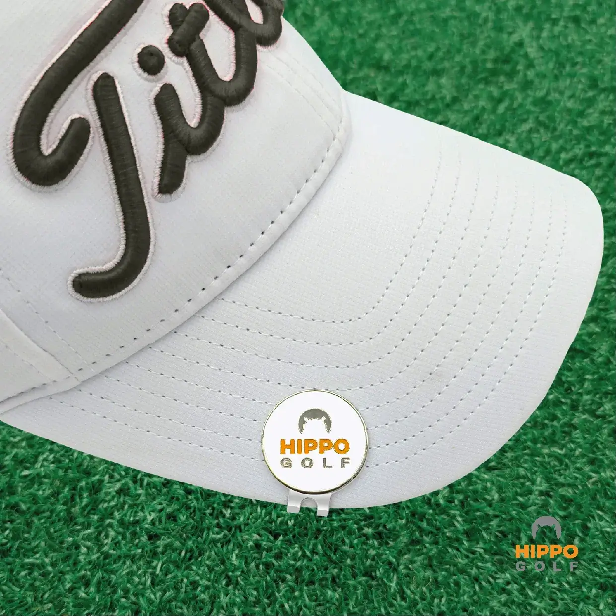 Ball marker with magnetic hat clip mounted on golf cap close up – 8103-08
