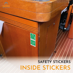 Boat safety sign kit stickers placed in the galley marking fire extinguisher and bilge pump.
