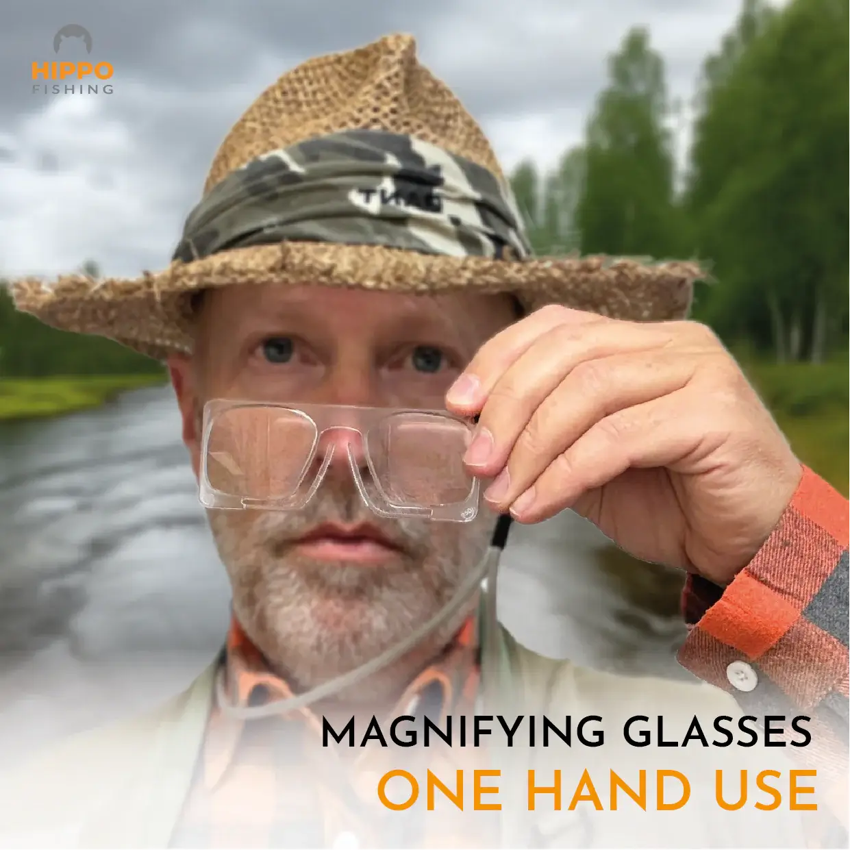 Fly fisherman holding fly fishing magnifier with grey lanyard showing easy one-hand use.