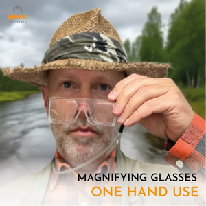 Fly fisherman holding fly fishing magnifier with grey lanyard showing easy one-hand use.