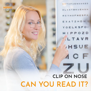 Woman using frameless pocket reading glasses to read an eye chart, compact thin-optic reading aid.