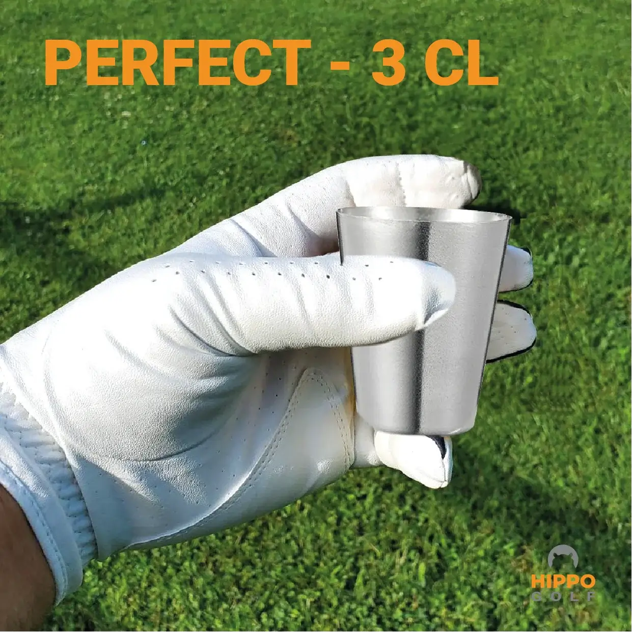 Golf shot glass 3 cl held in gloved hand on golf course – perfect size for golfers 8189-01
