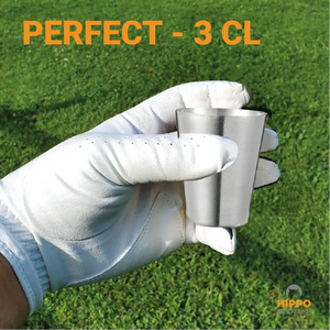 Golf shot glass 3 cl held in gloved hand on golf course – perfect size for golfers 8189-01