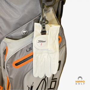 Golf glove holder keeping glove dry and accessible on golf bag