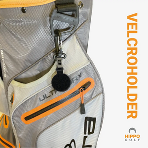Golf glove holder attached to golf bag using carabiner clip for quick access