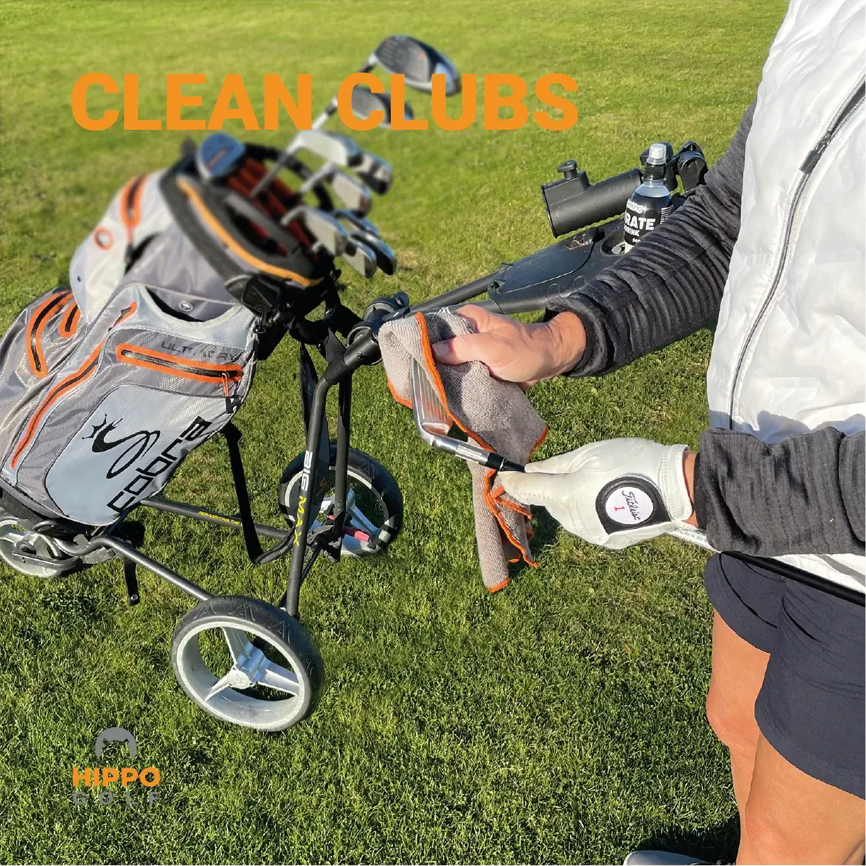 Cleaning golf clubs using Hippo Golf towel attached to golf bag – 8174-06
