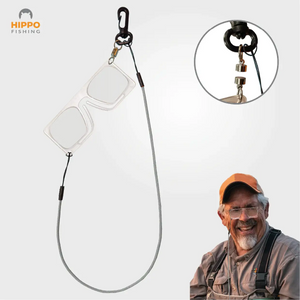 Magnetic fly fishing magnifier with grey band and quick-release magnet, shown worn by fisherman.
