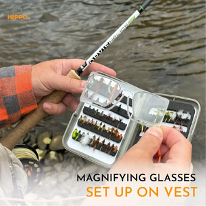 Angler using magnetic fly fishing magnifier with grey band to see fly and leader clearly.