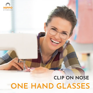 Thin-optic clip-on nose magnifier used one-handed for sewing, threading needles and precise handicraft work