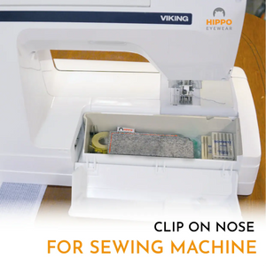 Thin-optic sewing needle magnifier stored inside a sewing machine compartment for easy access during sewing tasks